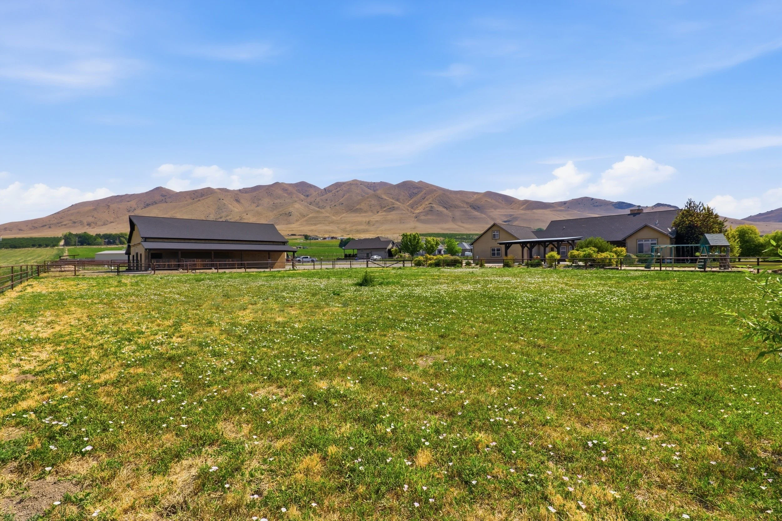 Pasture, barn, and rural home setting in Genola Utah