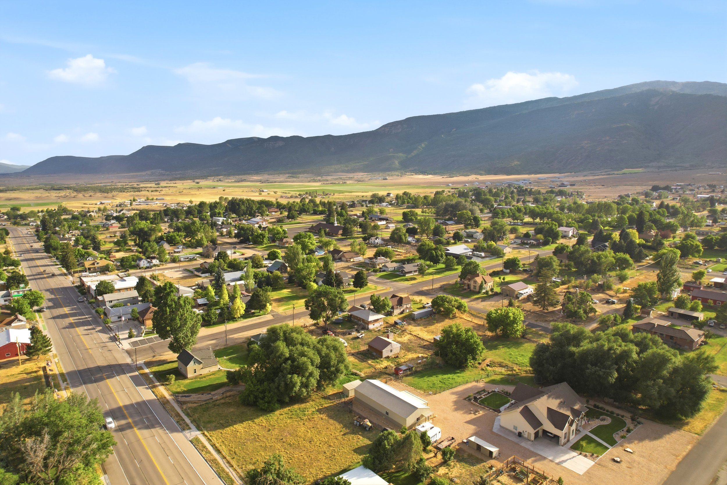 Aerial view of Fountain Green homes and open land around the traditional street grid