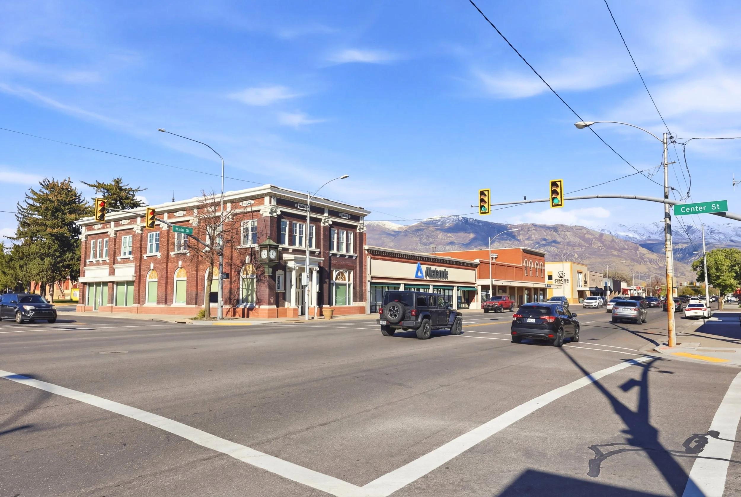 Historic Main Street and Center Street intersection in American Fork Utah with mountains beyond