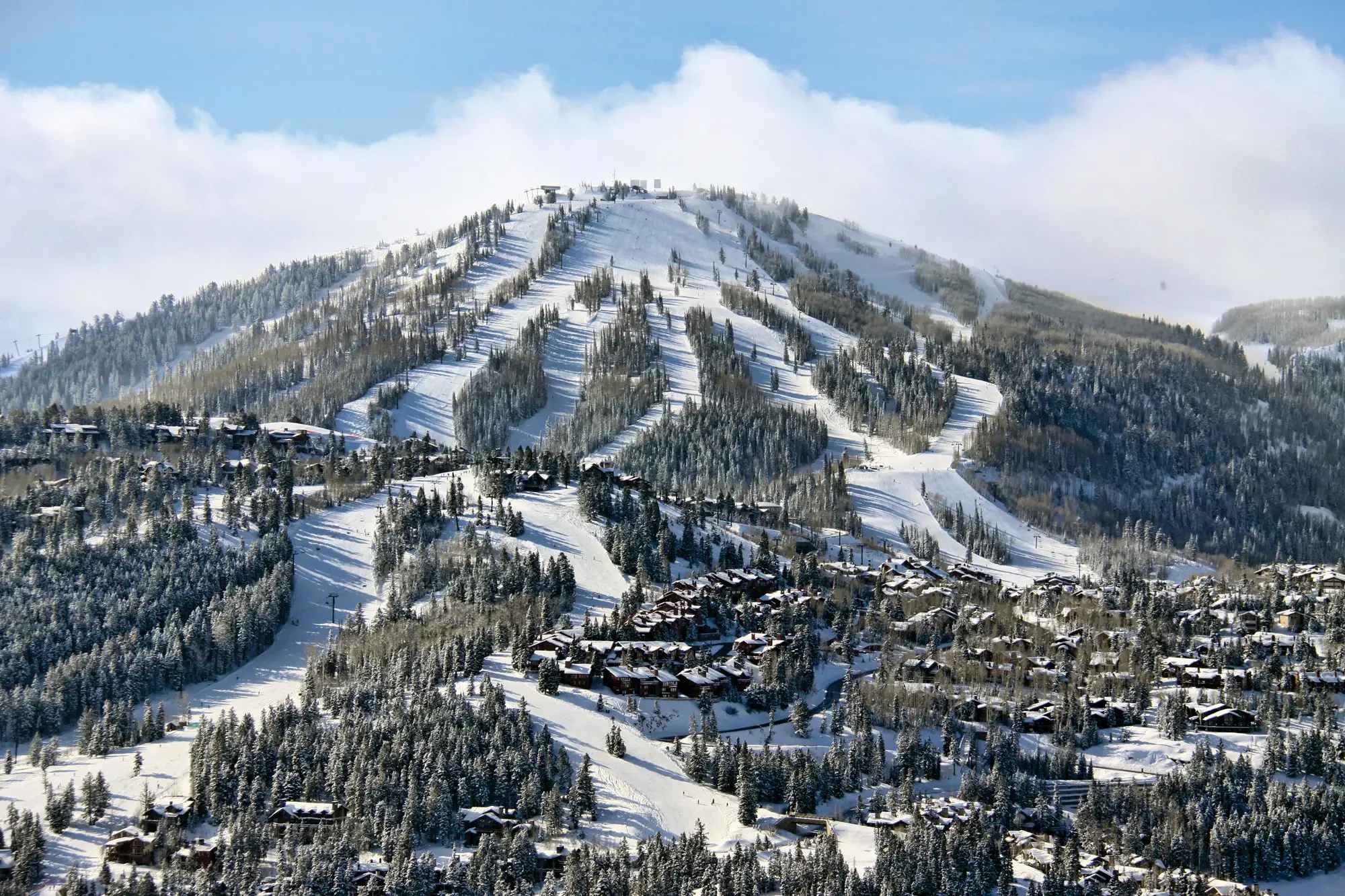 Snow covered Deer Valley ski slopes and luxury resort residences in Utah