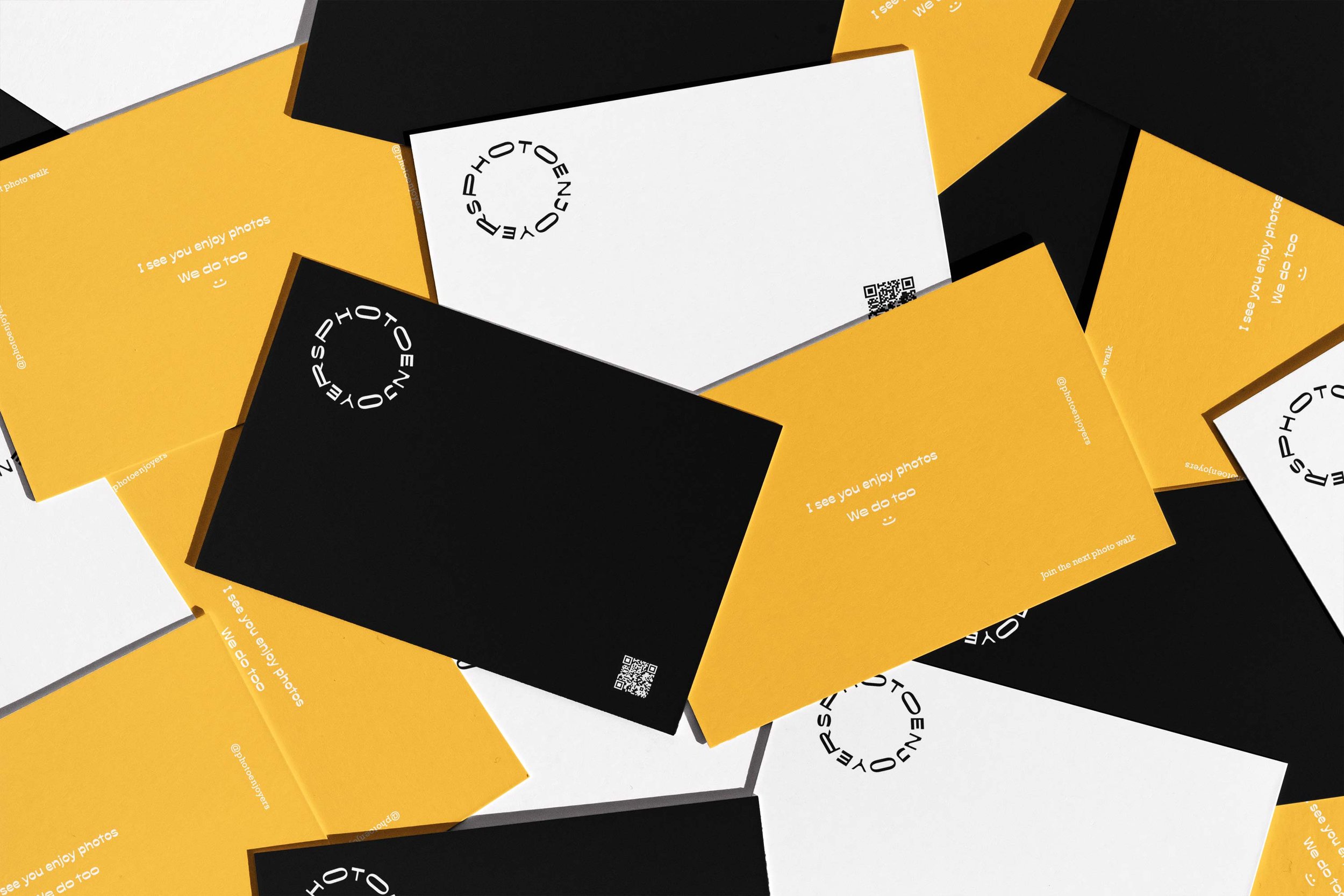 Mockup of black, orange, and white photo business cards for Photoenjoyers