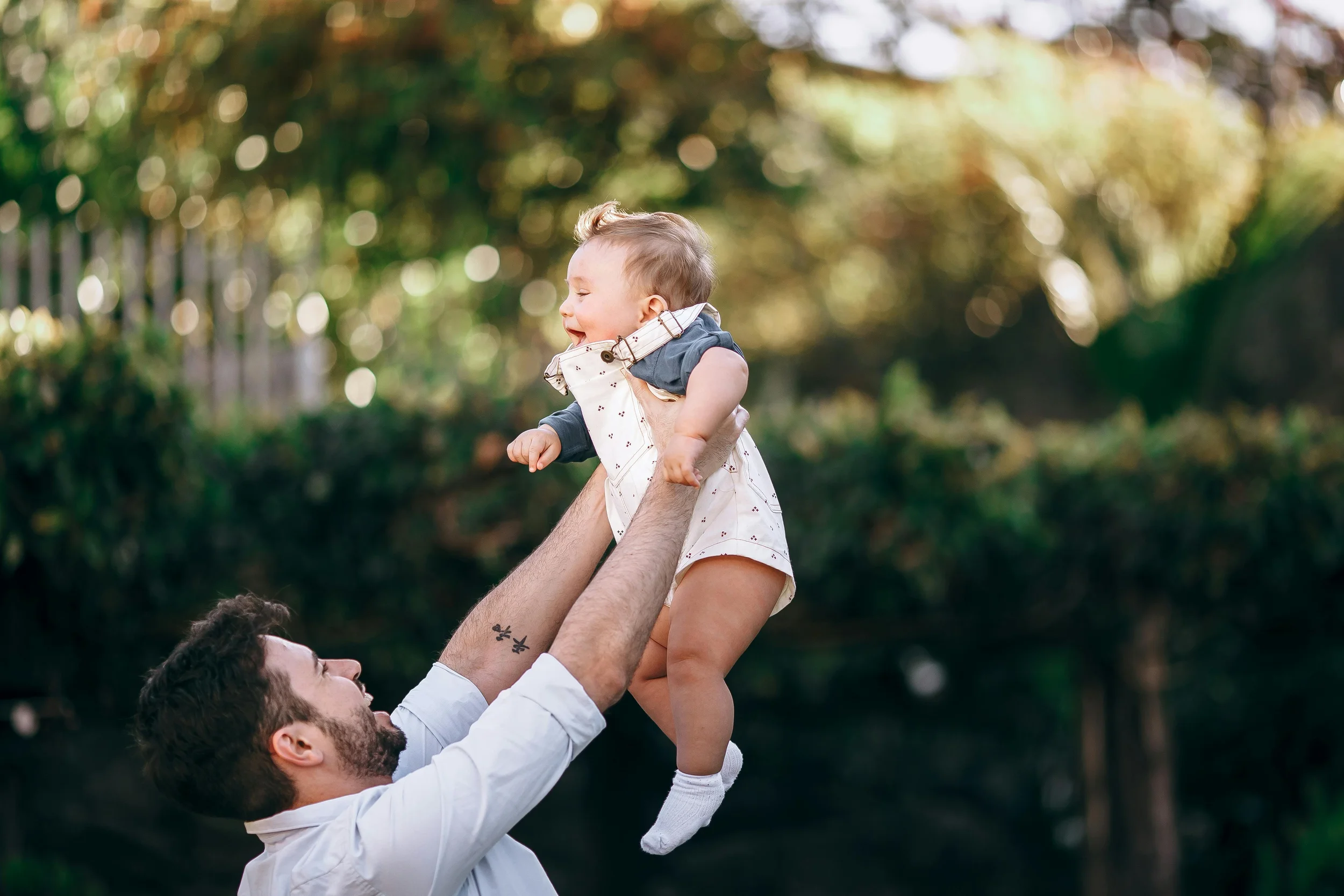 Dad and baby playing and thriving
