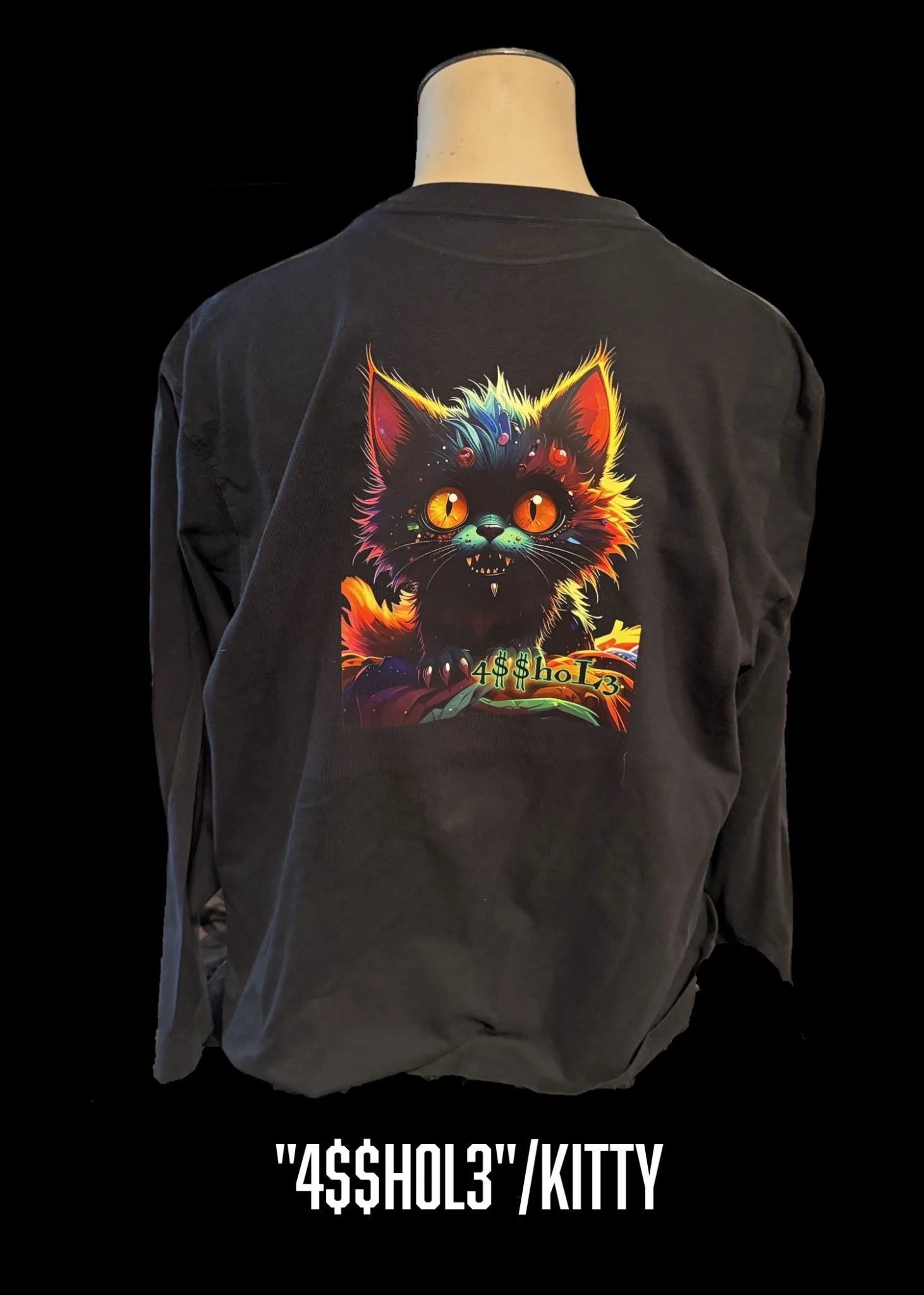 Black shirt with a colorful cat graphic by Firstborn Mercantile
