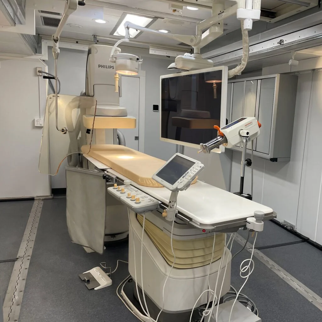 Interior of mobile cath lab showing advanced imaging equipment