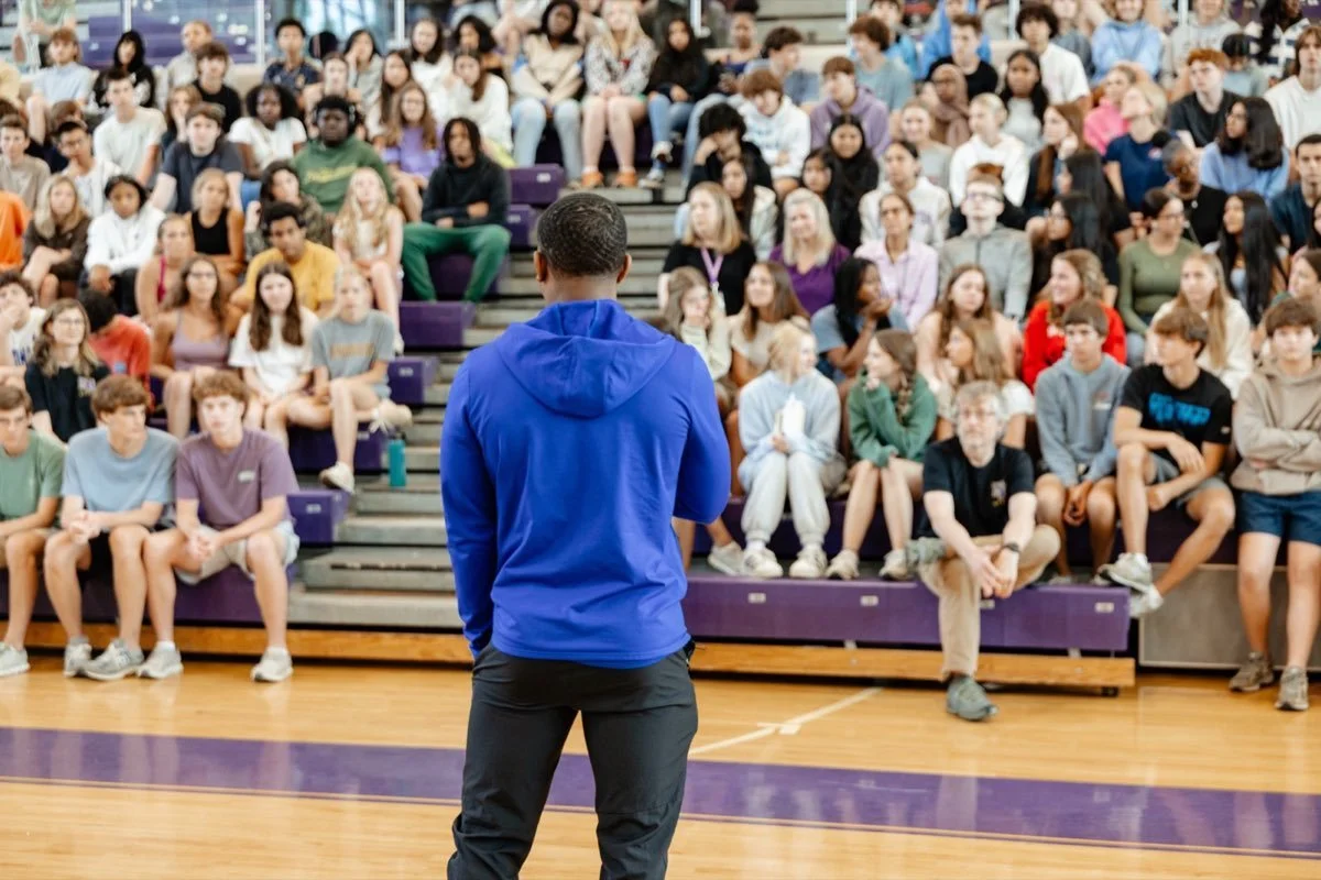 Professional athlete speaking to students during a BTP story assignment
