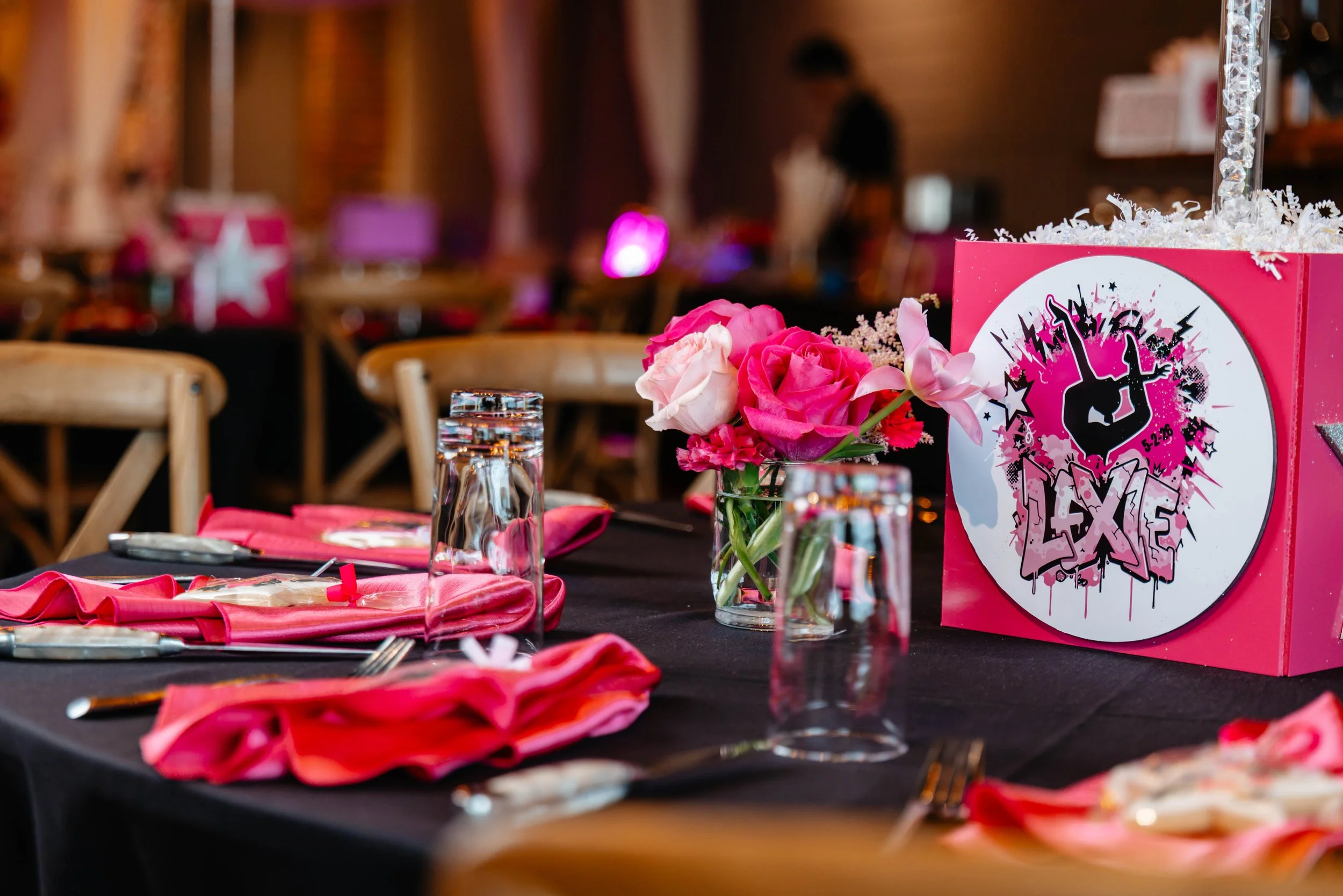 Pink floral event tablescape prepared before guests arrive