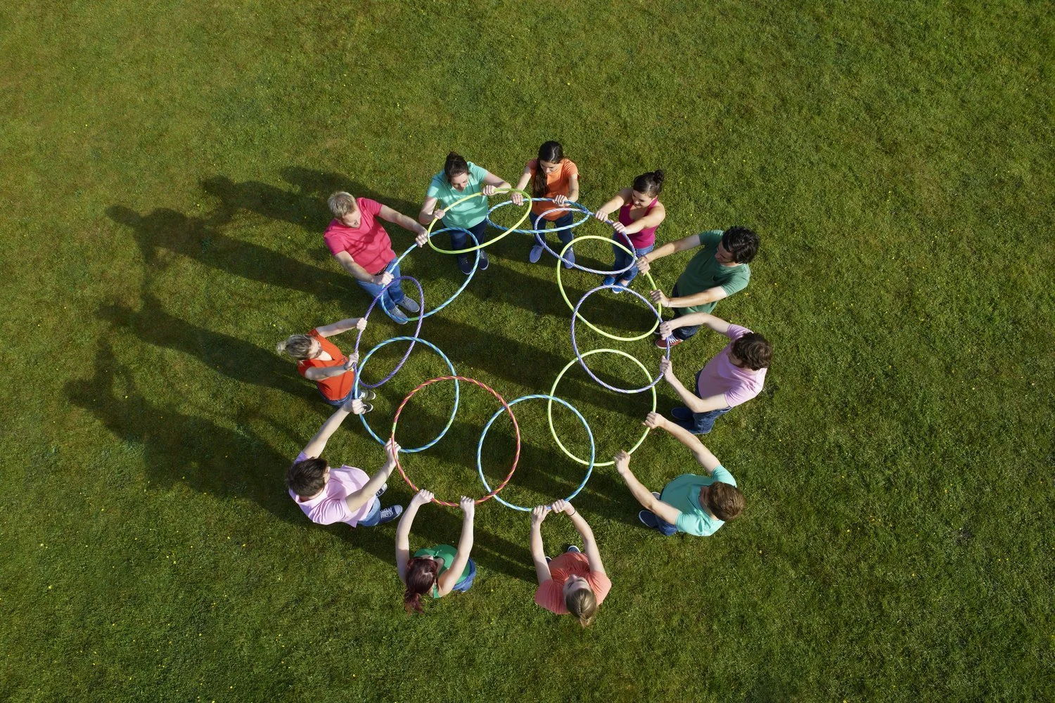 Kids and adults playing together outdoors