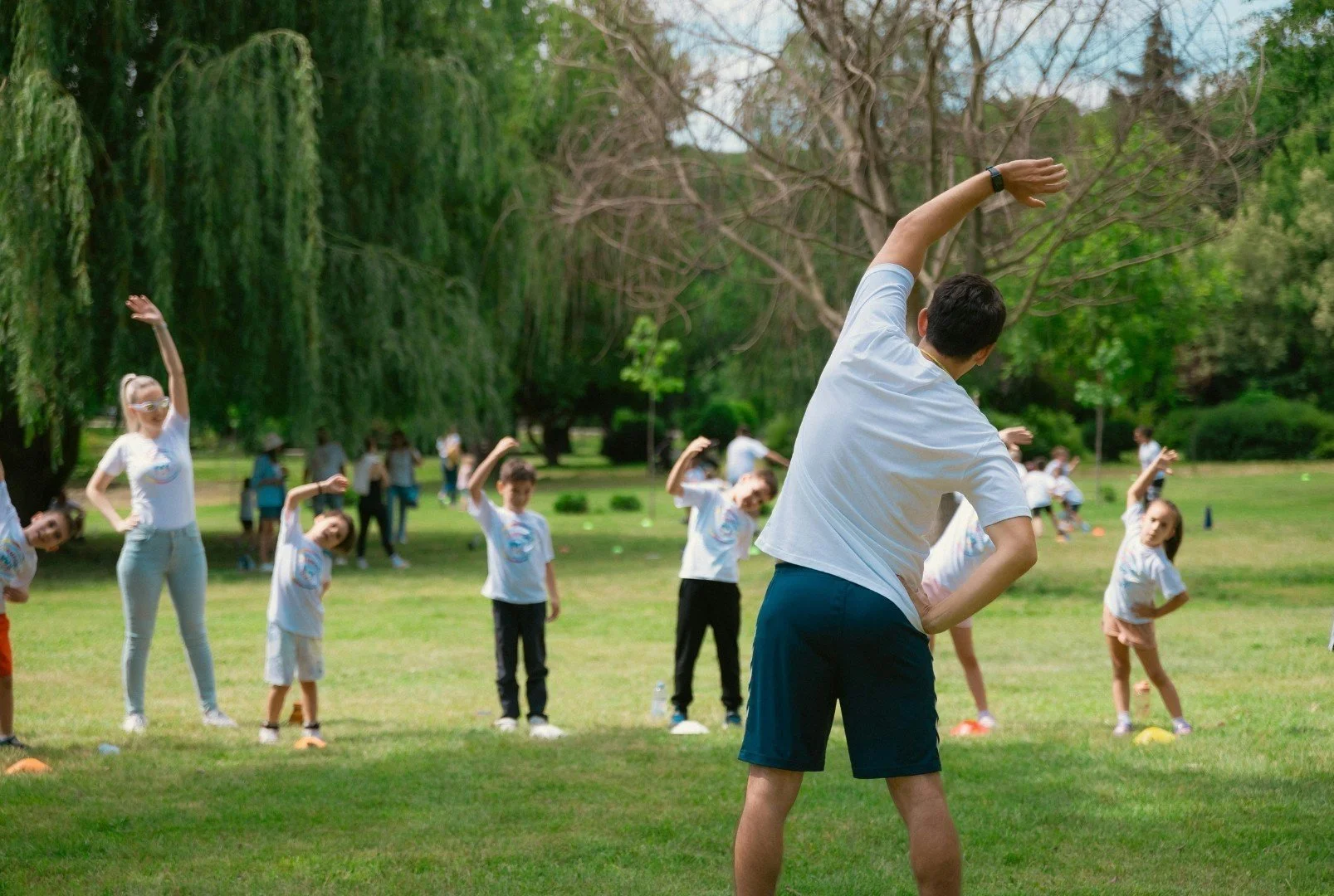 Kids climbing on a GameTime playground with a giant flower shade
