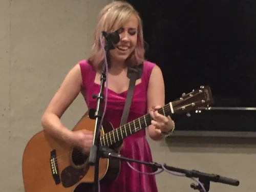 Singer-songwriter performing with acoustic guitar