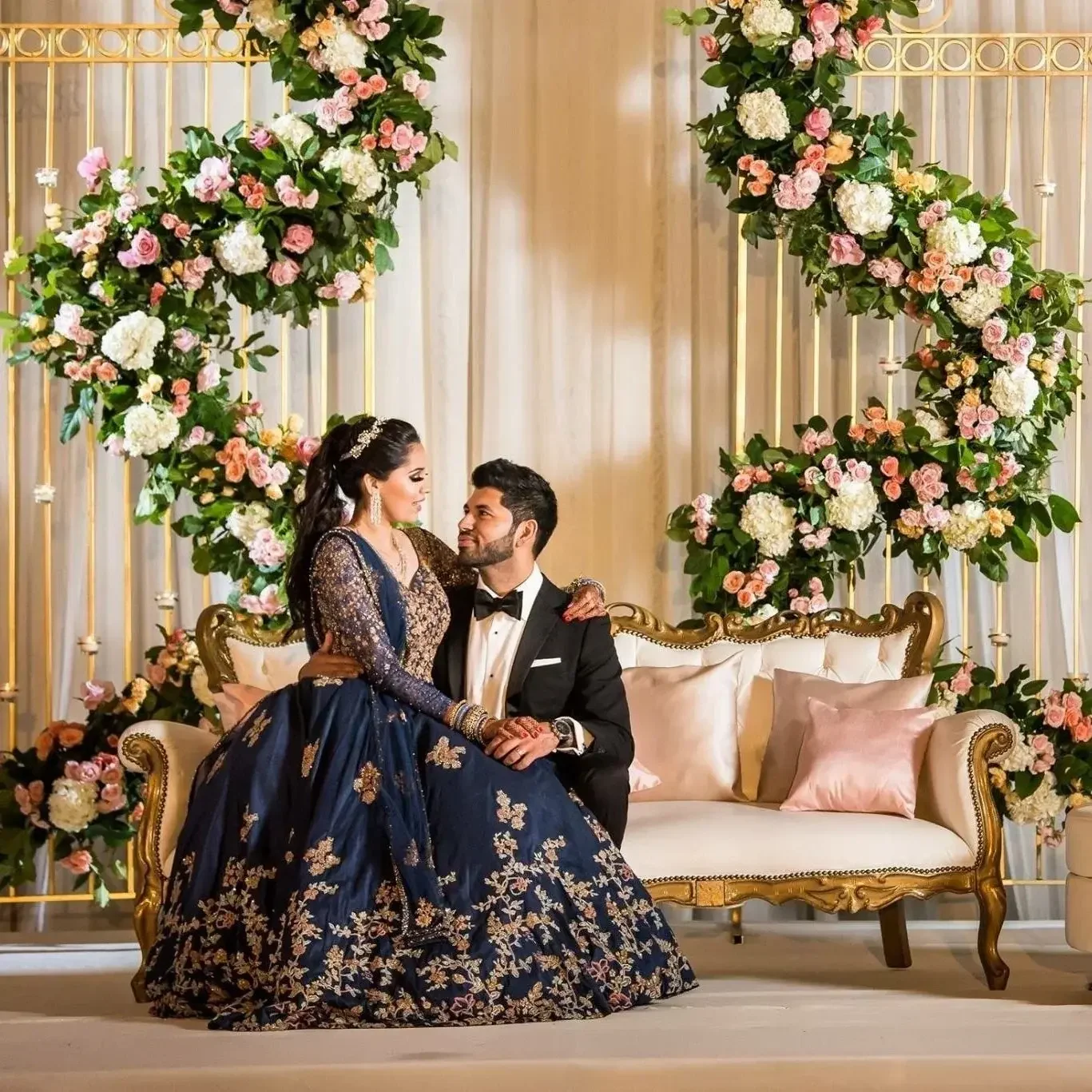 Couple in wedding attire at their celebration