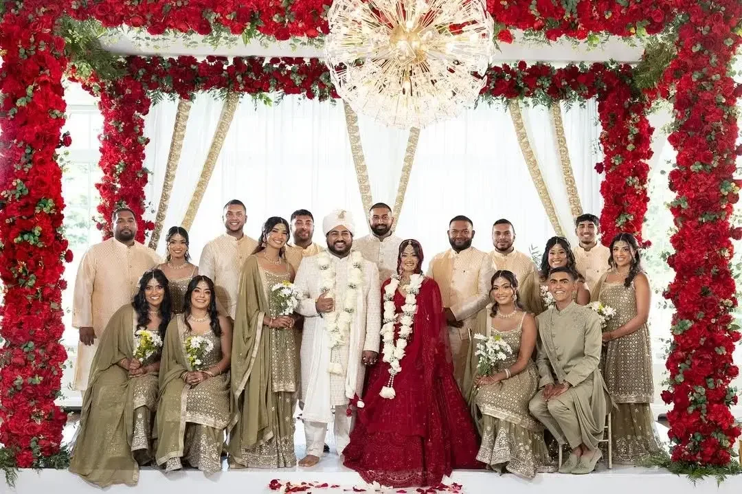 Wedding celebration under a floral canopy