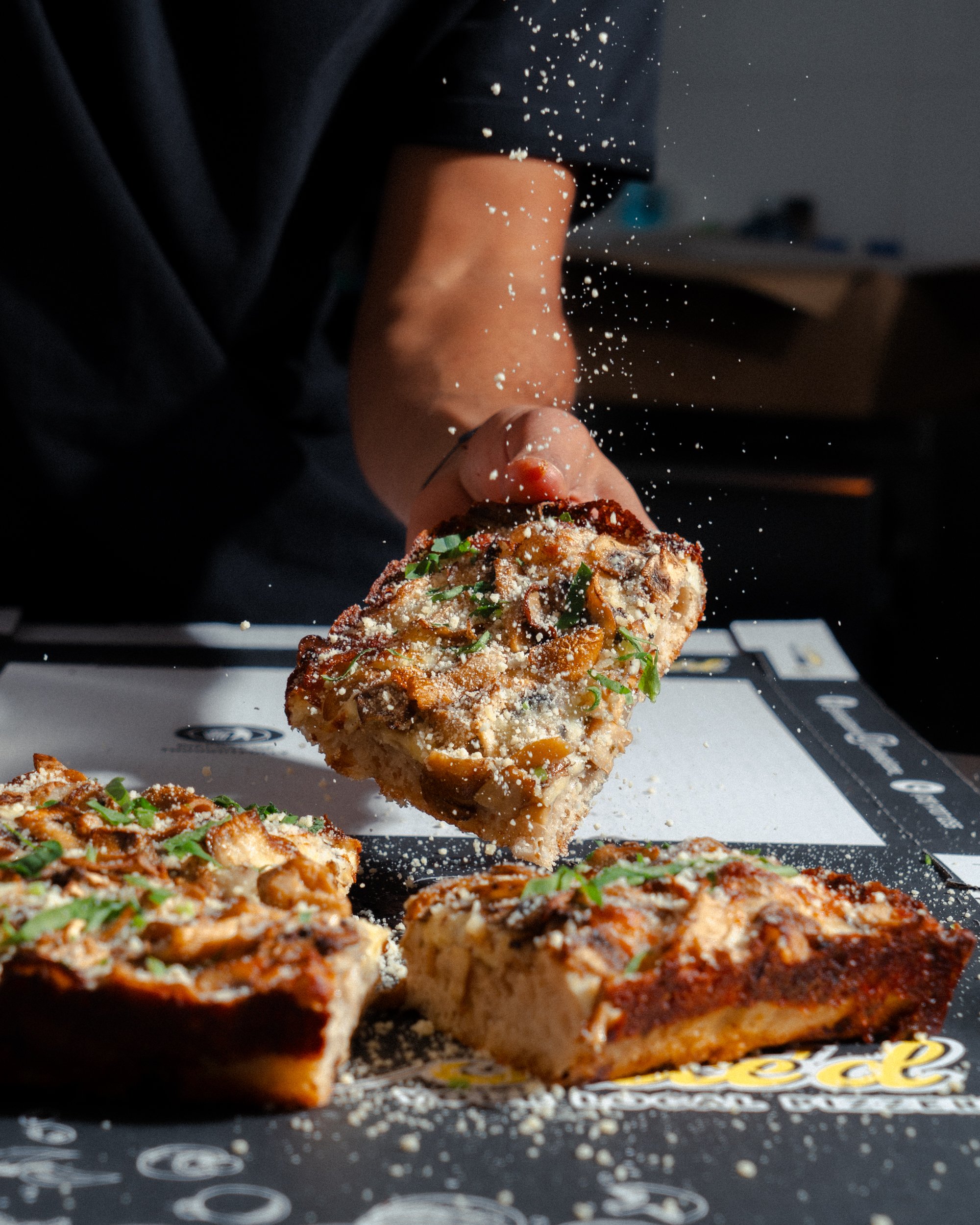 Pizza with cheese sprinkle ontop
