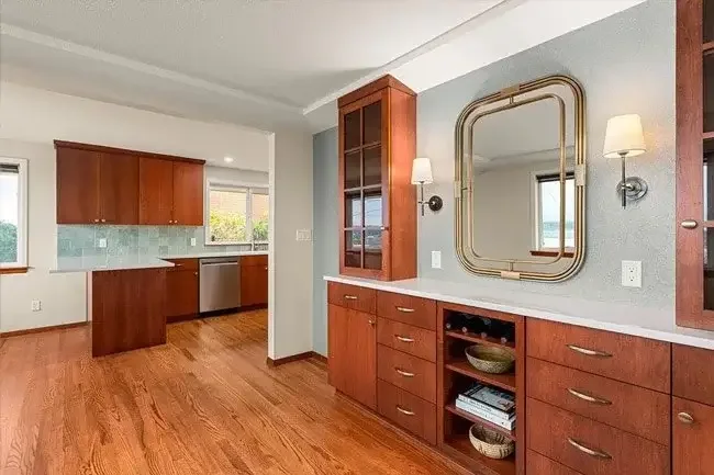 Completed Tacoma Narrows home remodel with warm wood cabinetry and coordinated interior finishes