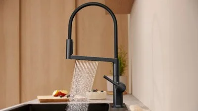 Black pull-down faucet and updated plumbing in Bellevue kitchen remodel