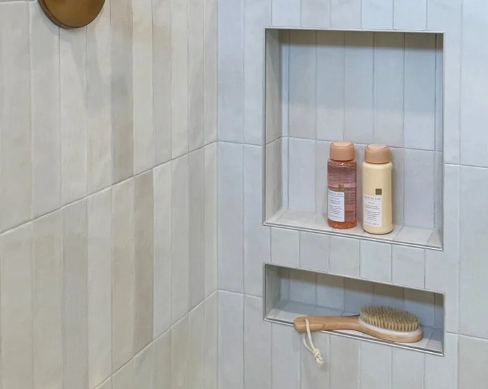 Built-in shower niches with shelving in large-format tile—smart storage for a Tacoma, WA bathroom remodel