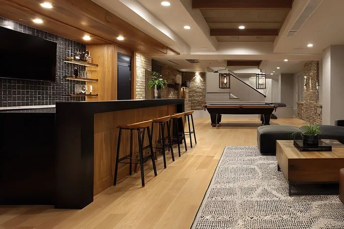 Basement kitchenette with wet bar, under-counter fridge, and open shelving in Maple Valley WA