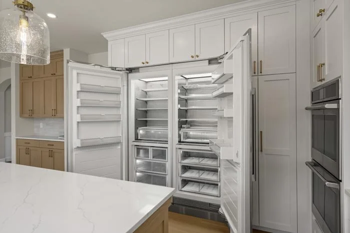 Built-in refrigerator and double oven in luxury Tacoma kitchen remodel