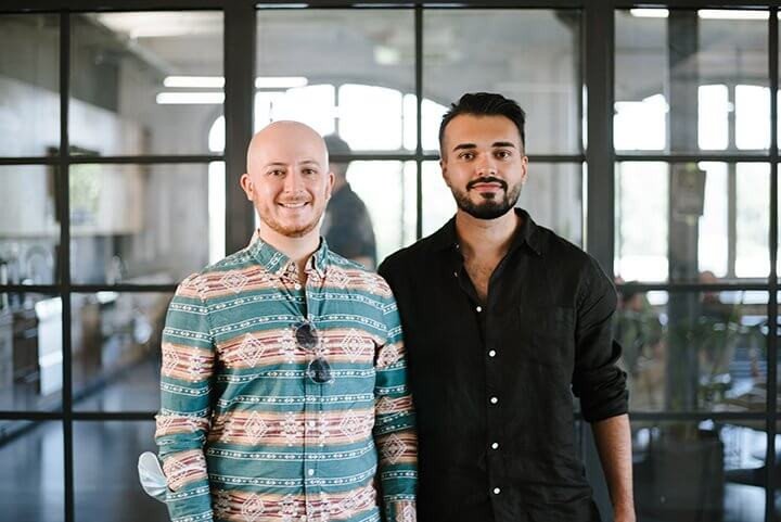 two adults standing side to side