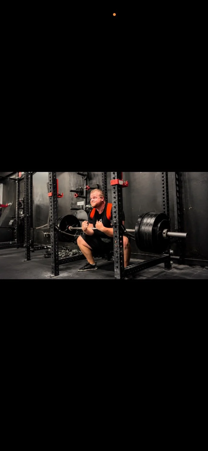 Paxton Titus performing a barbell squat