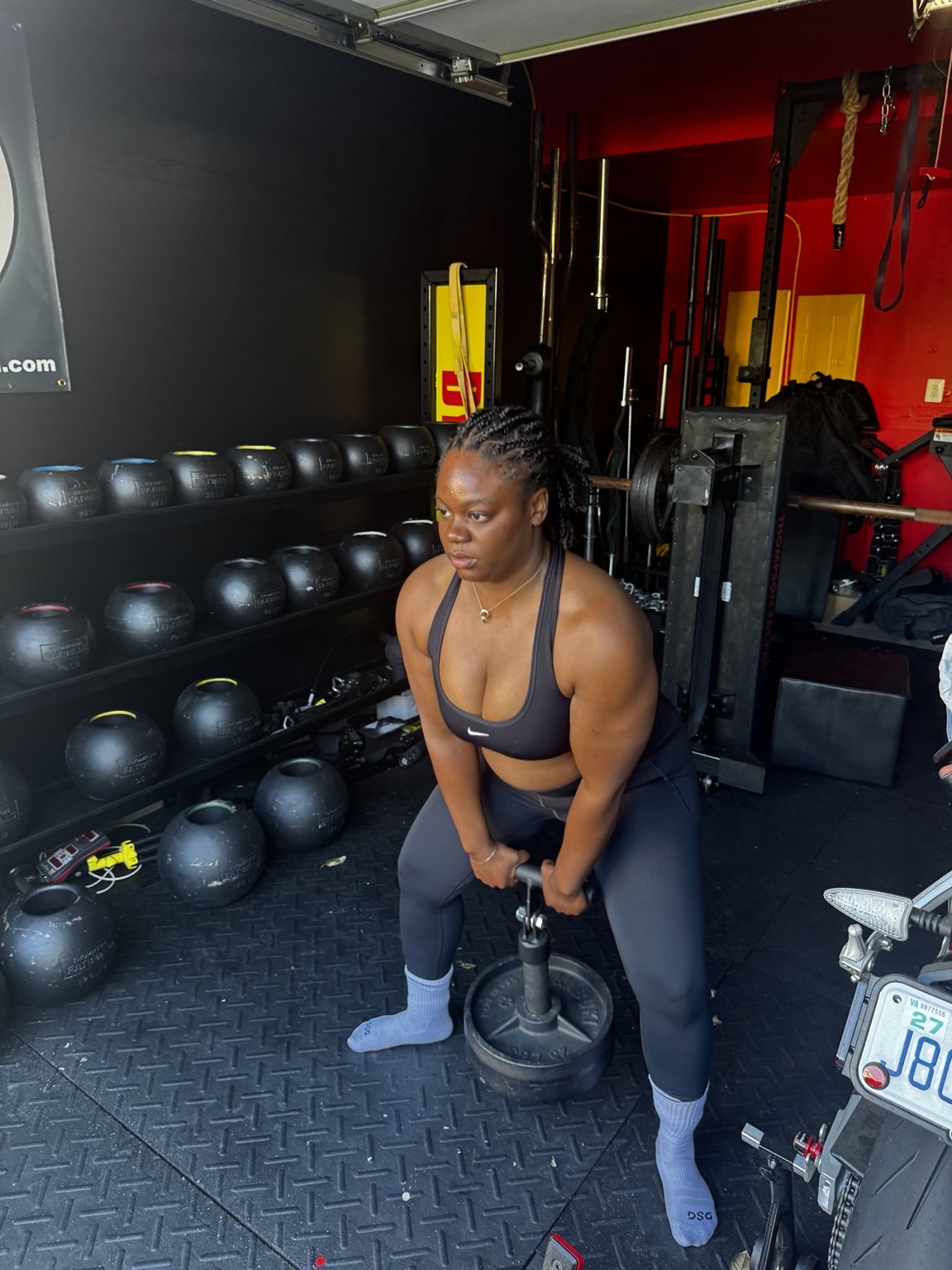 Athlete performing a kettlebell strength exercise