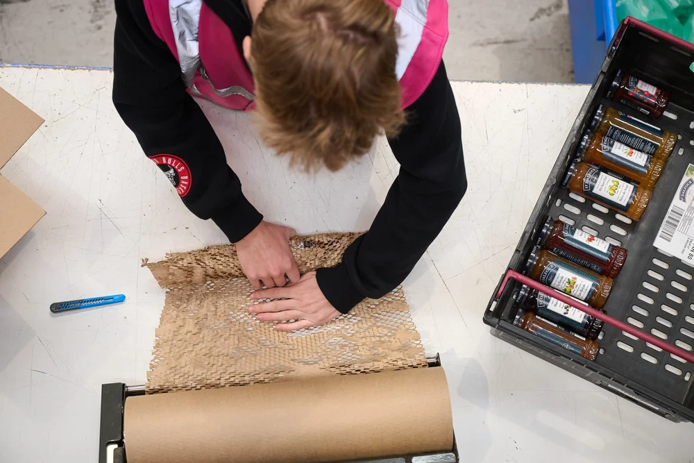Packing an ecommerce order with paper void fill at Scale 3PL