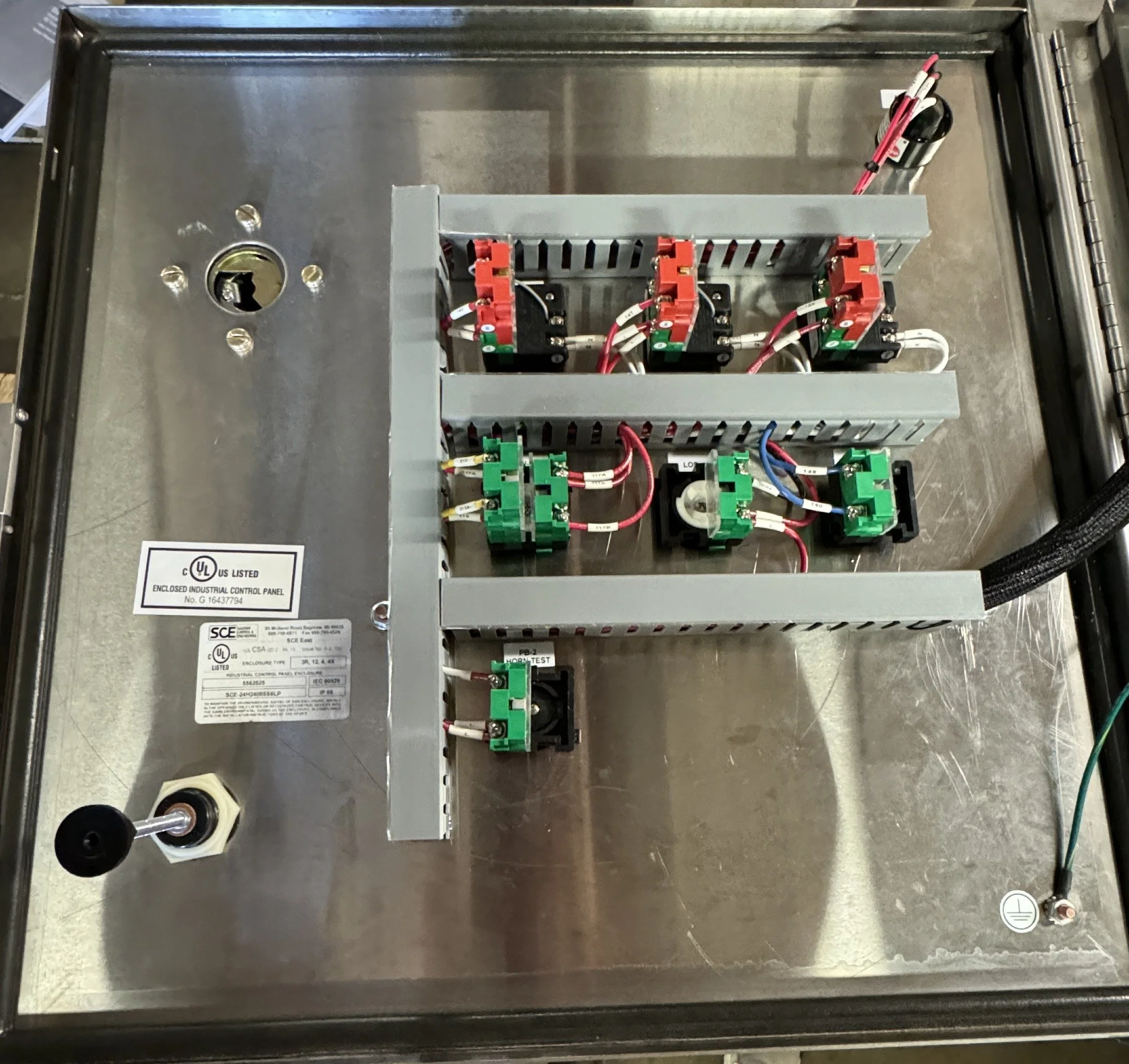 Door mounted control wiring inside the sump pump panel
