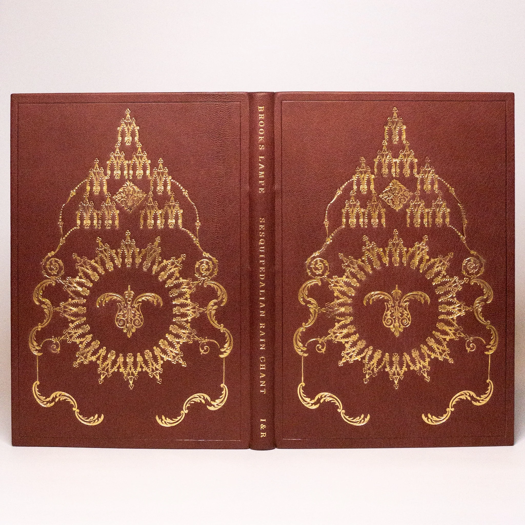 Fine art edition &mdash; full open spread with gold tooling, hand-bound by McCall Co. Bindery