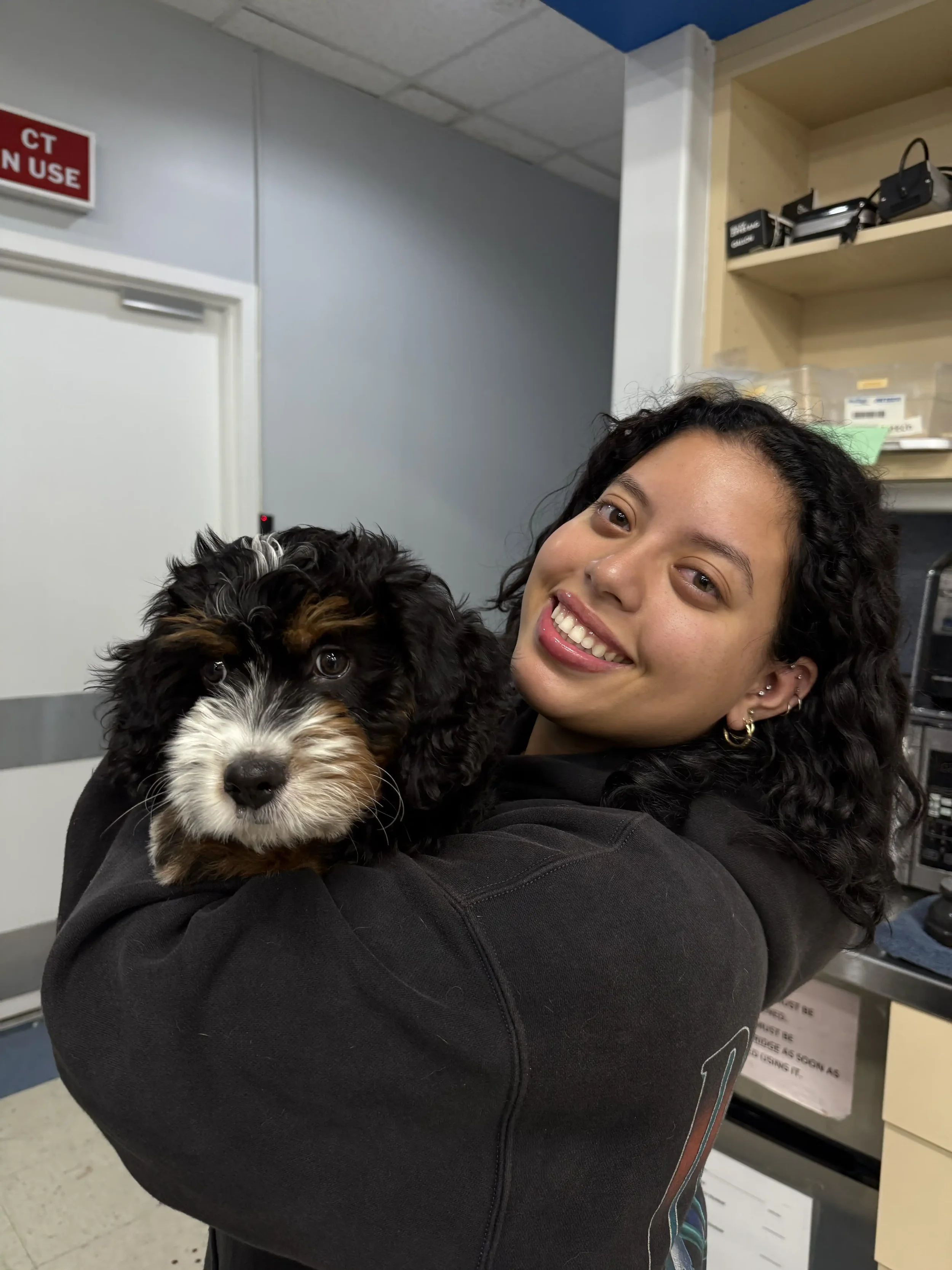 Gabriela providing gentle veterinary support to a pet