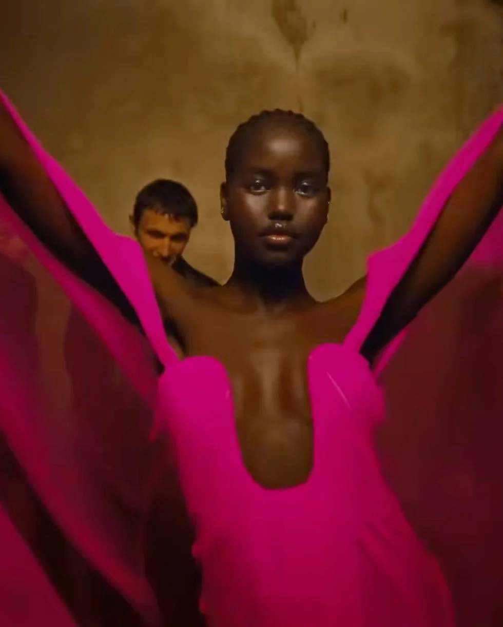 Valentino Born in Roma Extradose: a woman in a pink gown, arms raised
