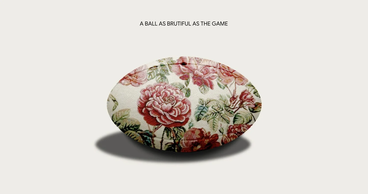 A rugby ball covered in a red rose print