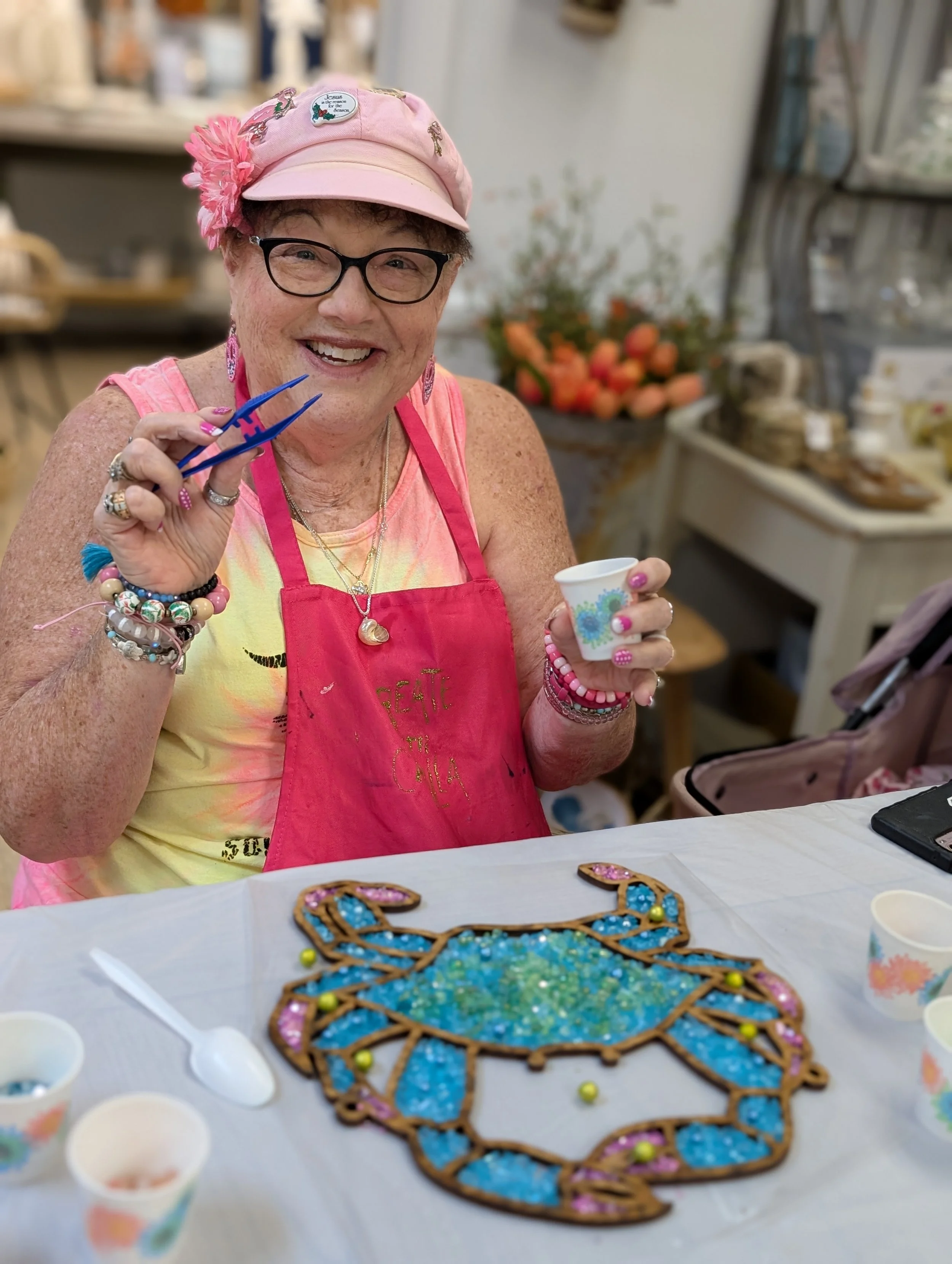 A guest proudly holding her colorful South Carolina artwork