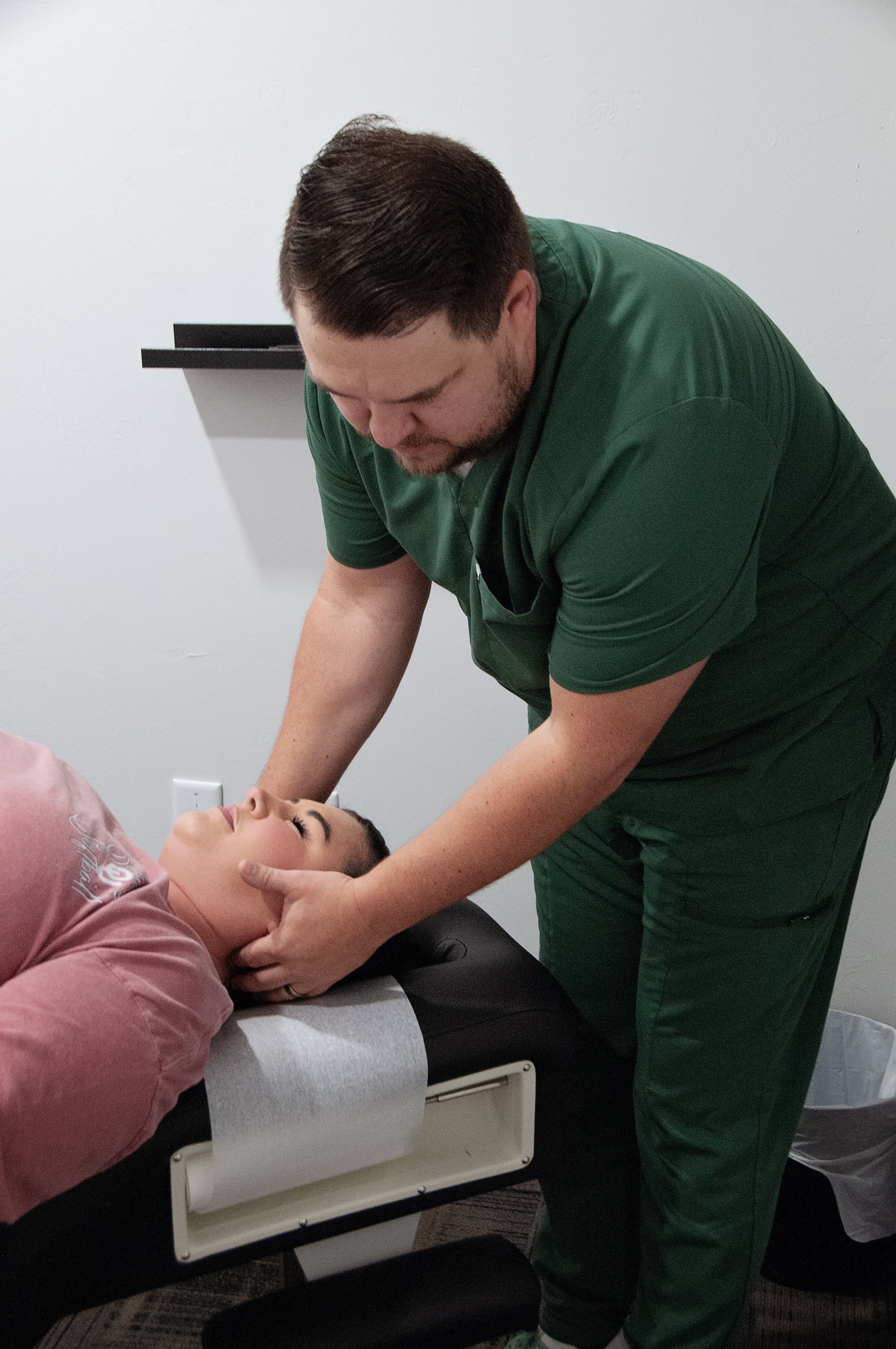 Chiropractor doing a neck adjustment