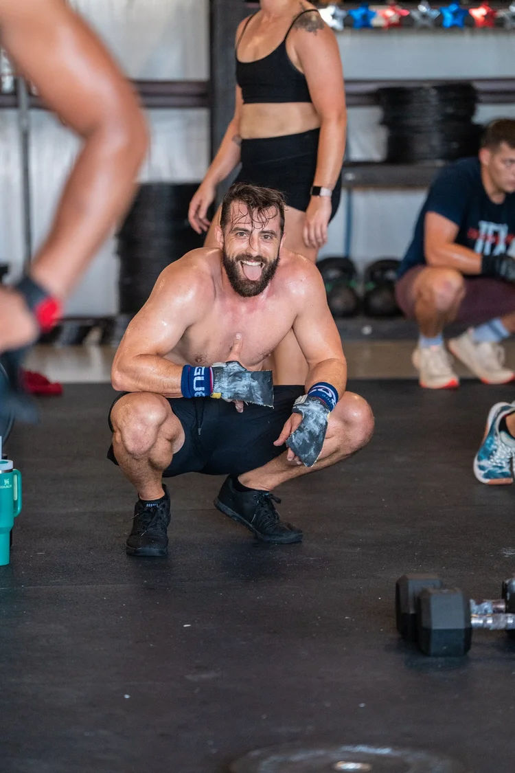 Member smiling mid-workout at Einhorn Training Co.