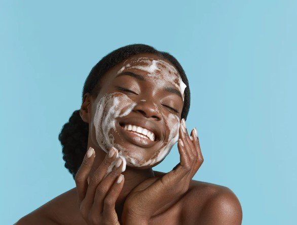 woman-with-big-smile-enjoying-foam-on-her-face