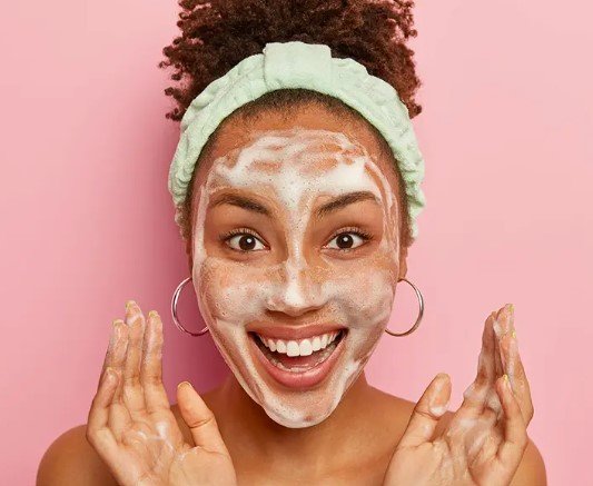 woman-with-big-smile-and-foam-on-her-face