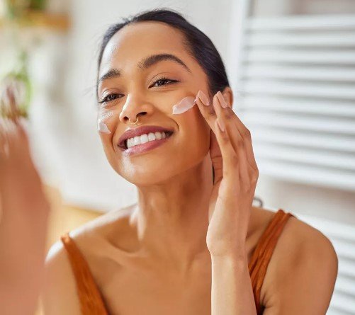 woman-smiling-taking-care-of-her-skin