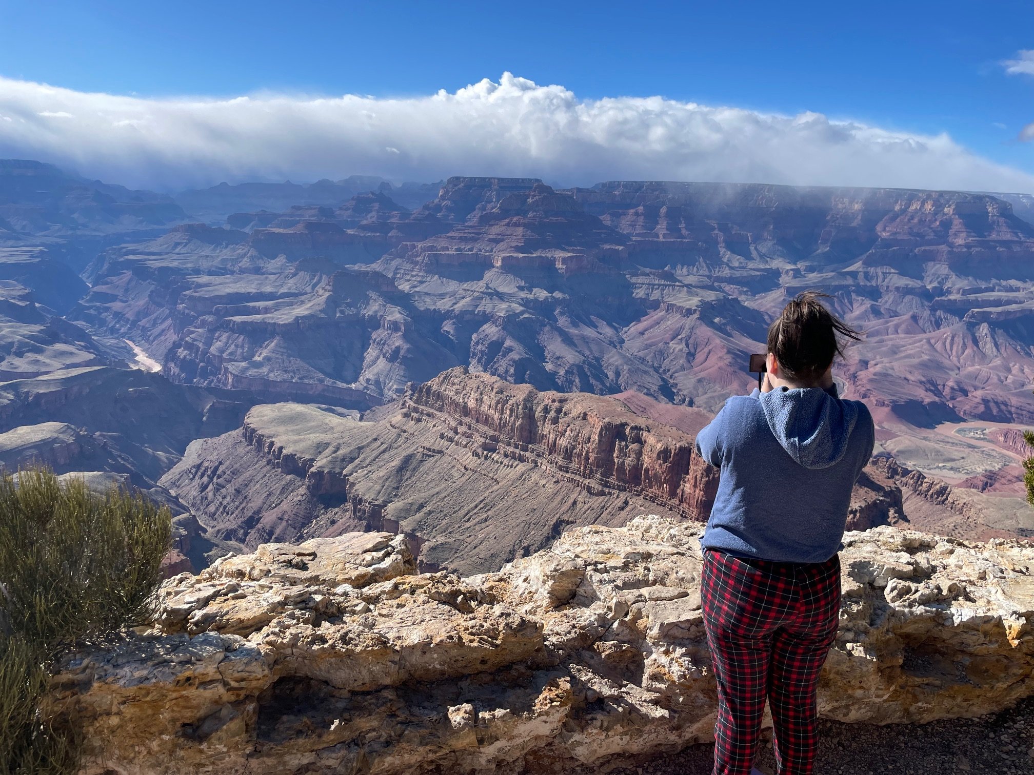 A photo of a child photographing the Grand Canyon