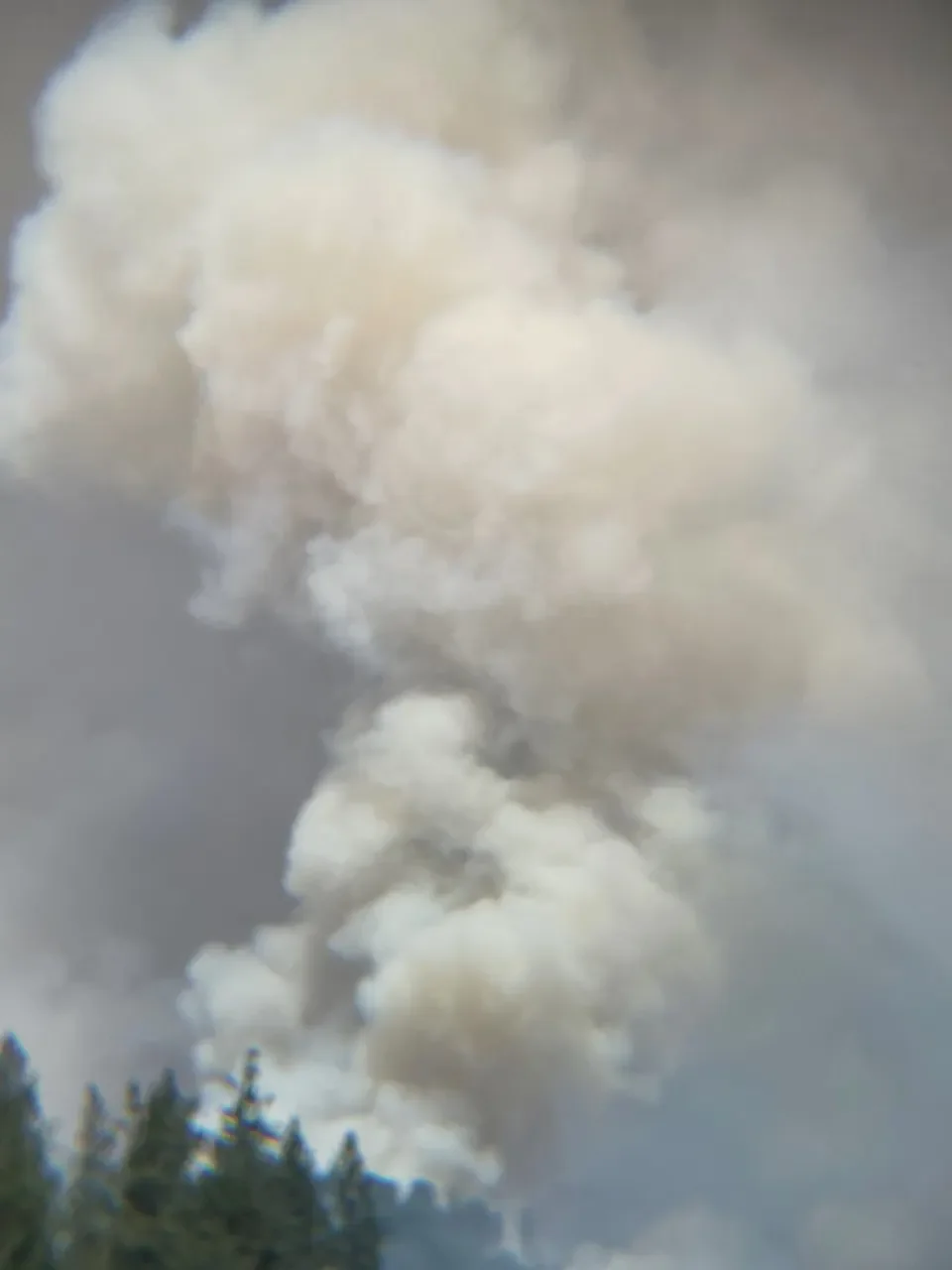 Wildfire smoke billowing in the distance
