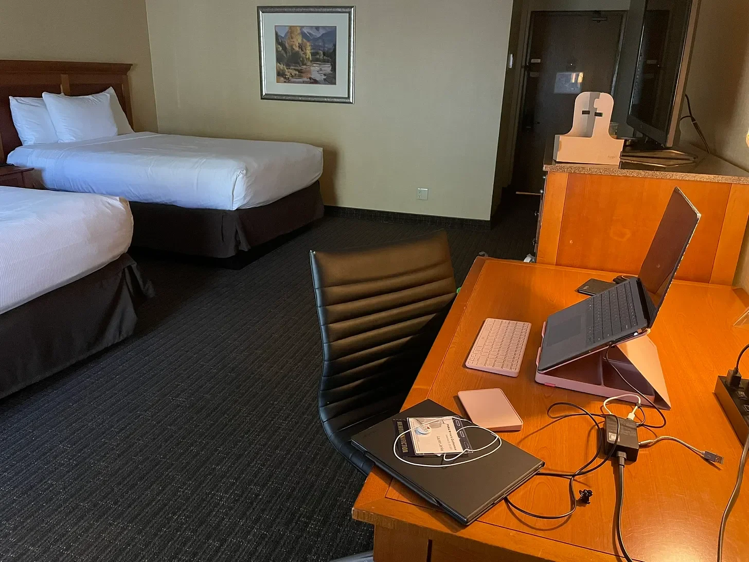 Desk in a hotel room with laptop