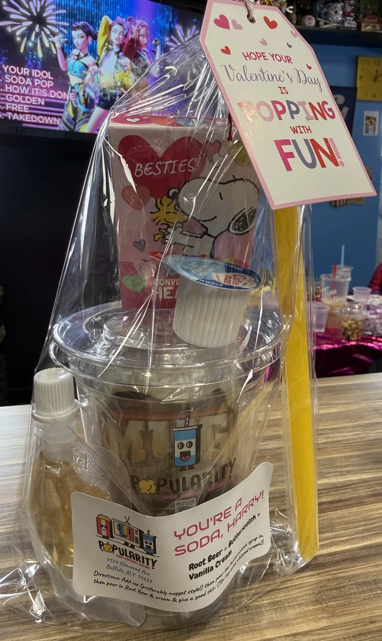 A POPularity! take-home dirty soda kit with syrup, cream and a recipe card