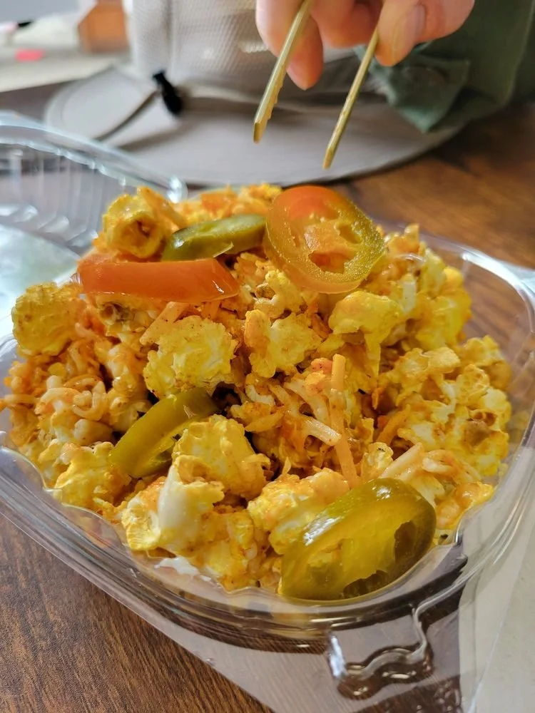 Yo Quiero Taco POPcorn — Dirty Loaded POPcorn with queso, taco seasoning, shredded cheddar and crushed Doritos