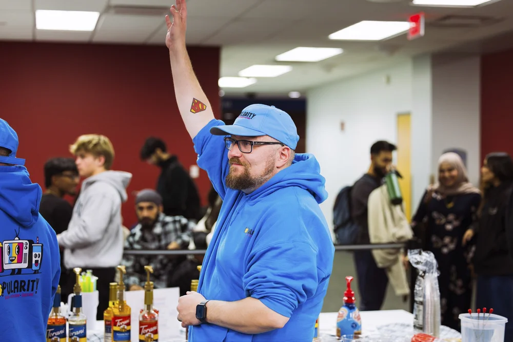 Dave running the POPularity! bar at a University at Buffalo event