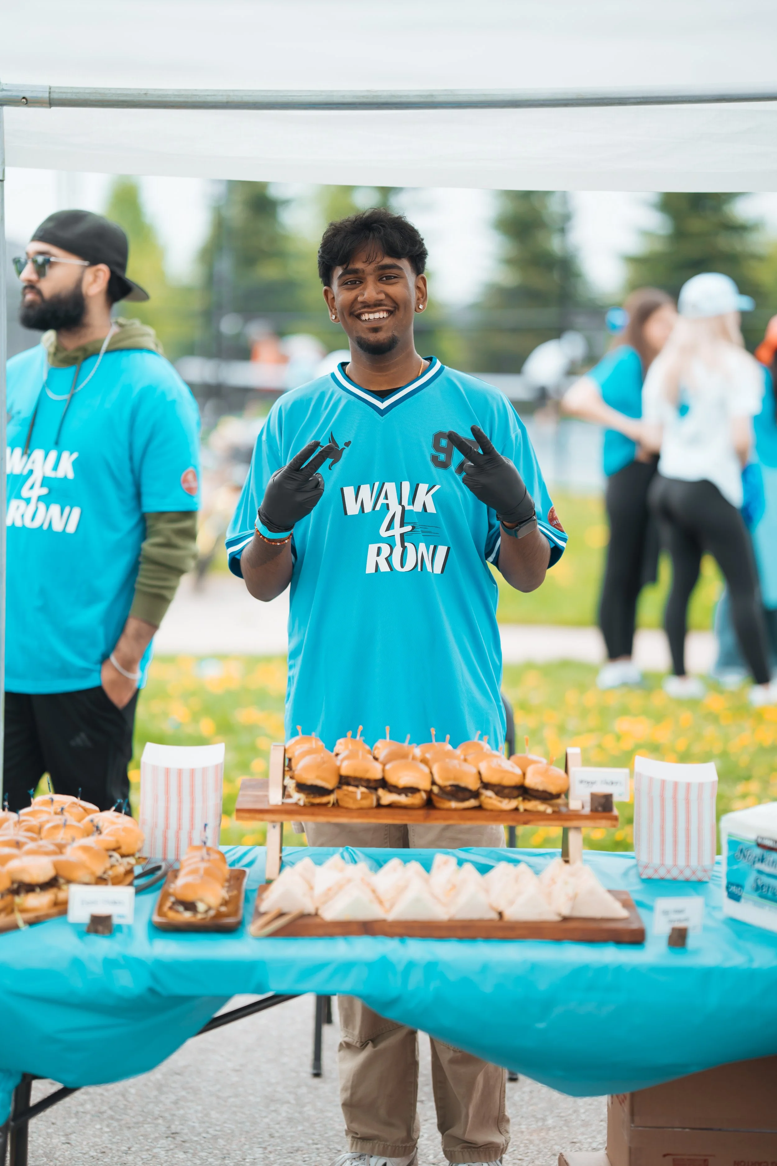 Volunteer at food station smiling