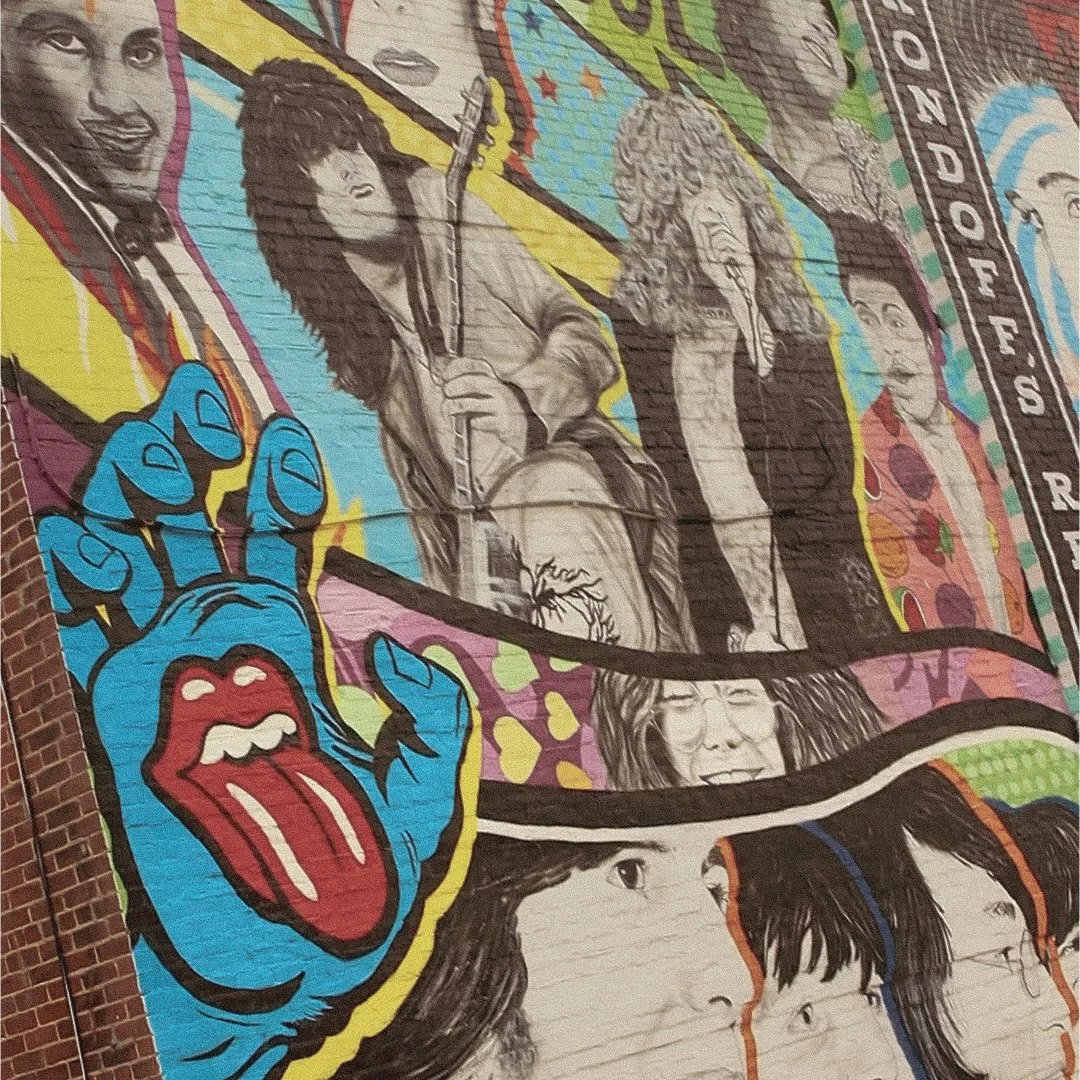 Artist focused on tattoo work at Social Graces