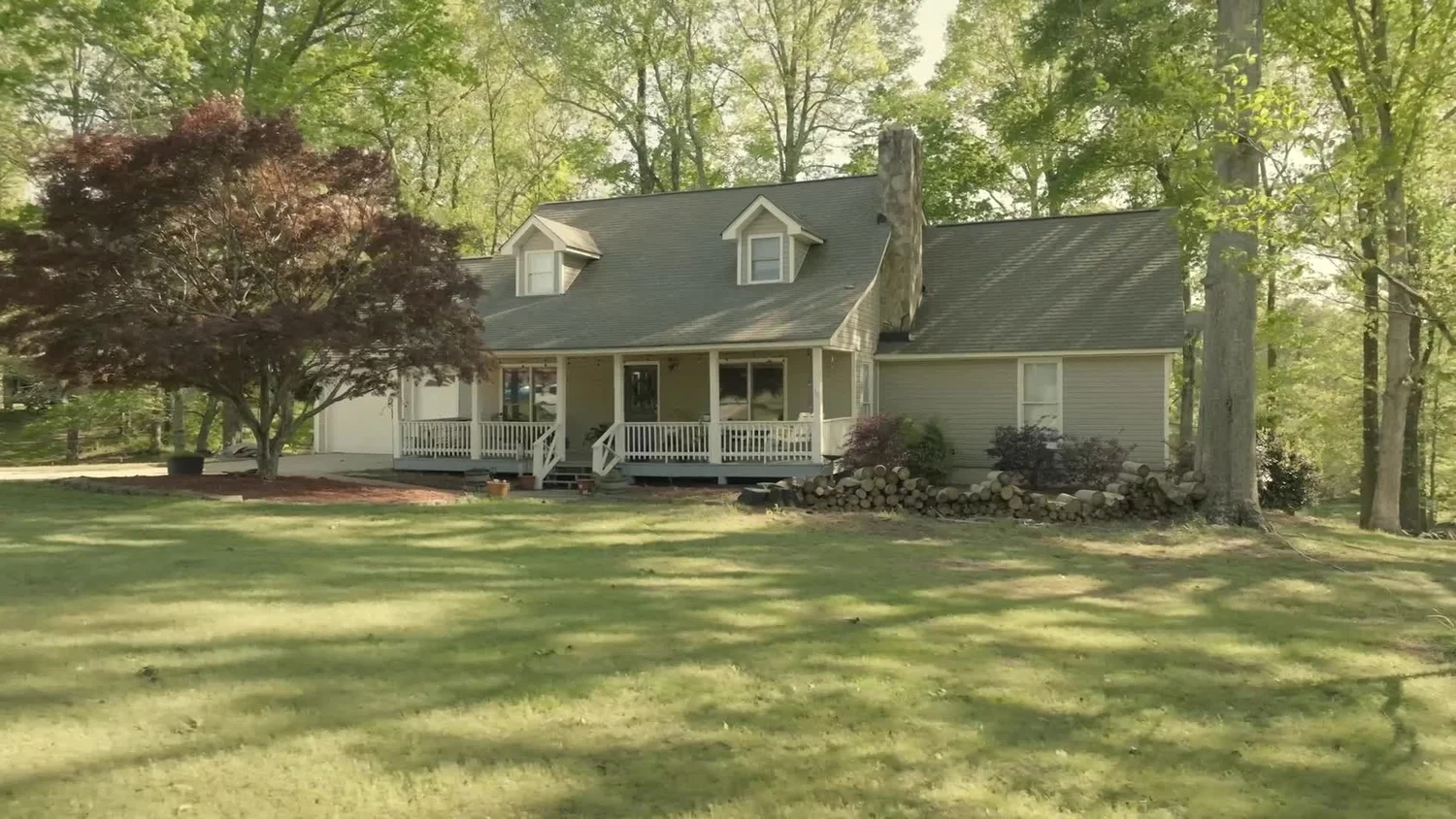 Preview of an edited real estate video showing a home and surrounding land.