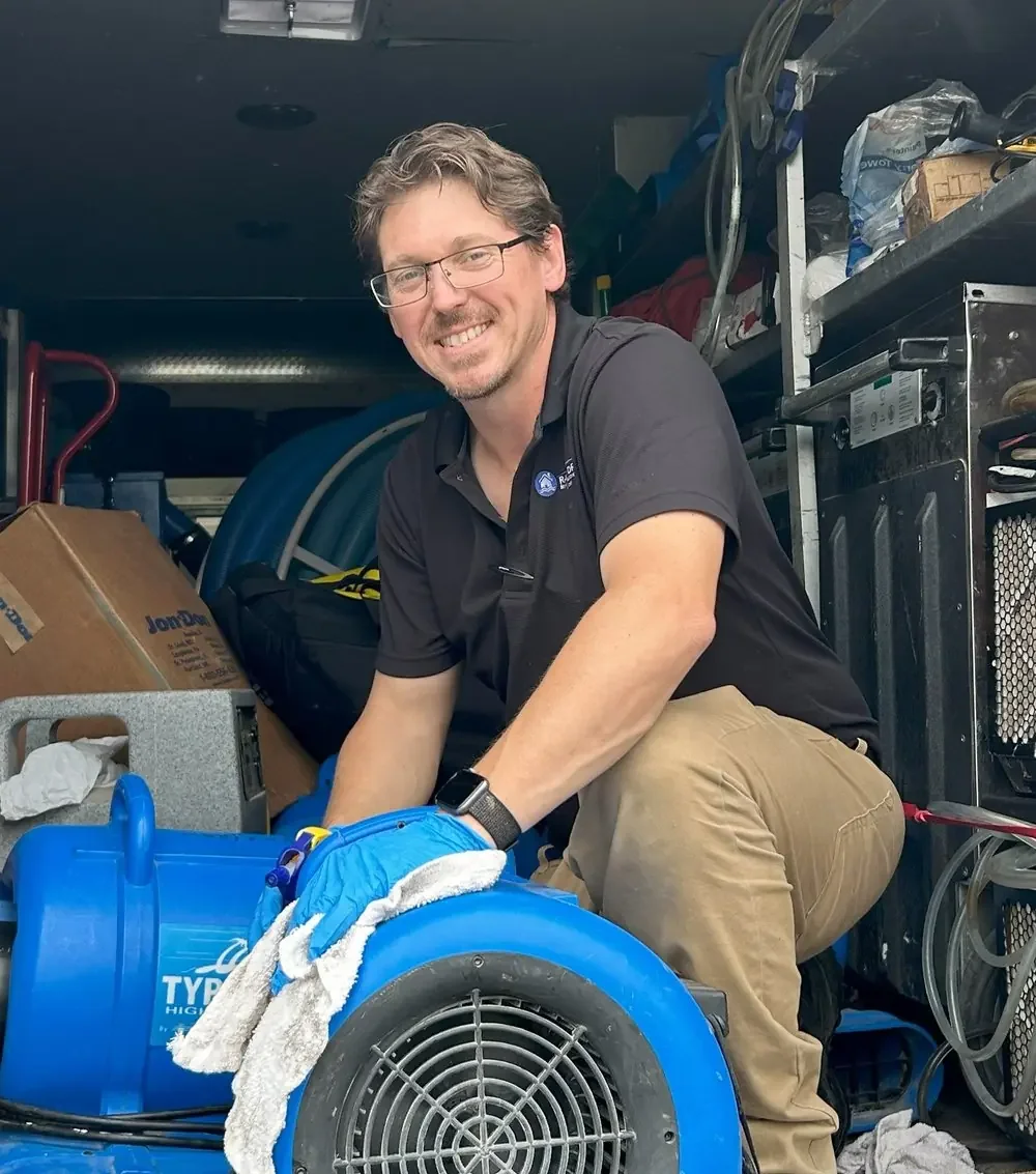 Rapid Dry owner Dustin Lawson with professional water damage restoration equipment in Central Texas