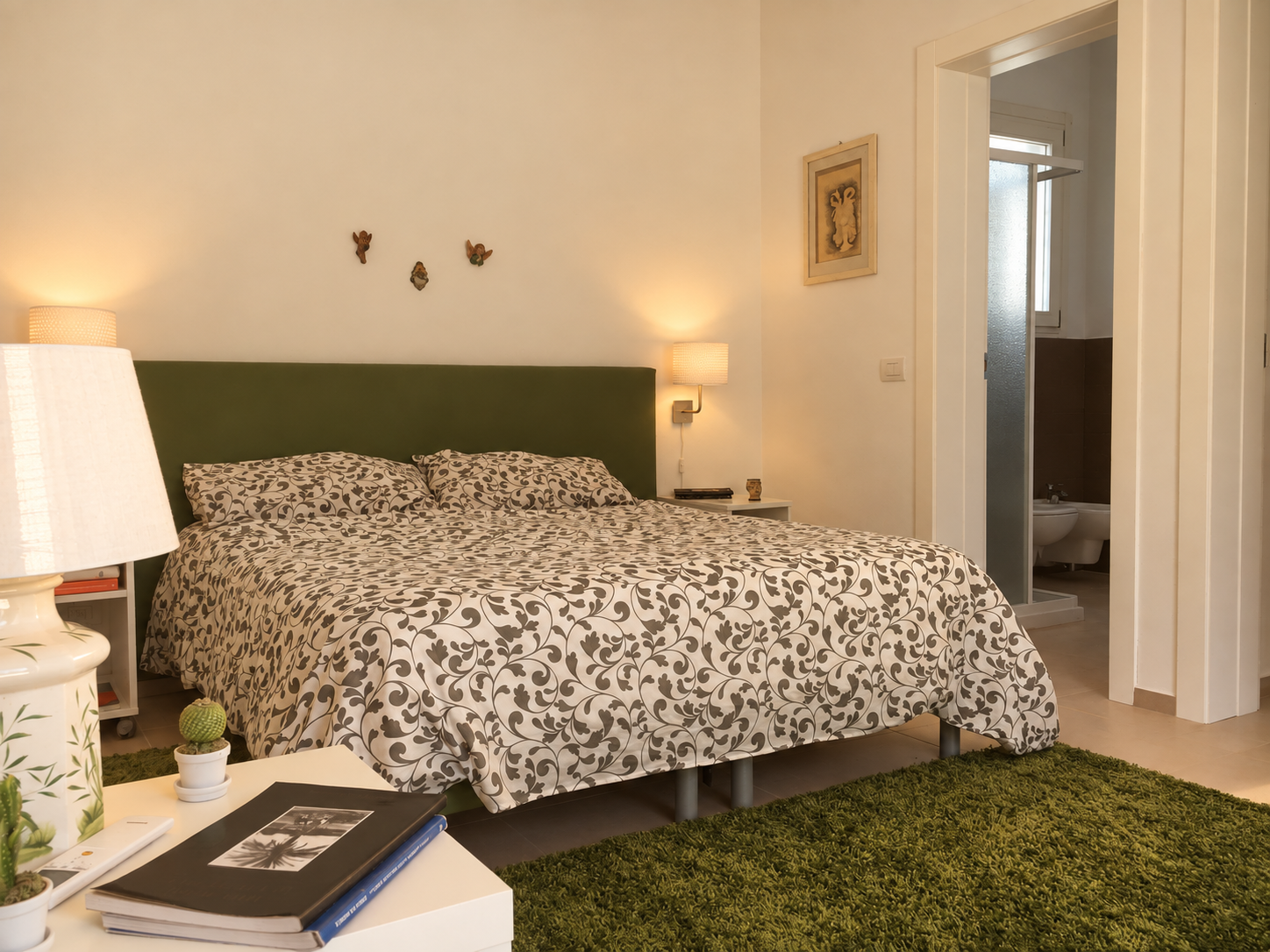 Bedroom with a double bed and doorway to the bathroom