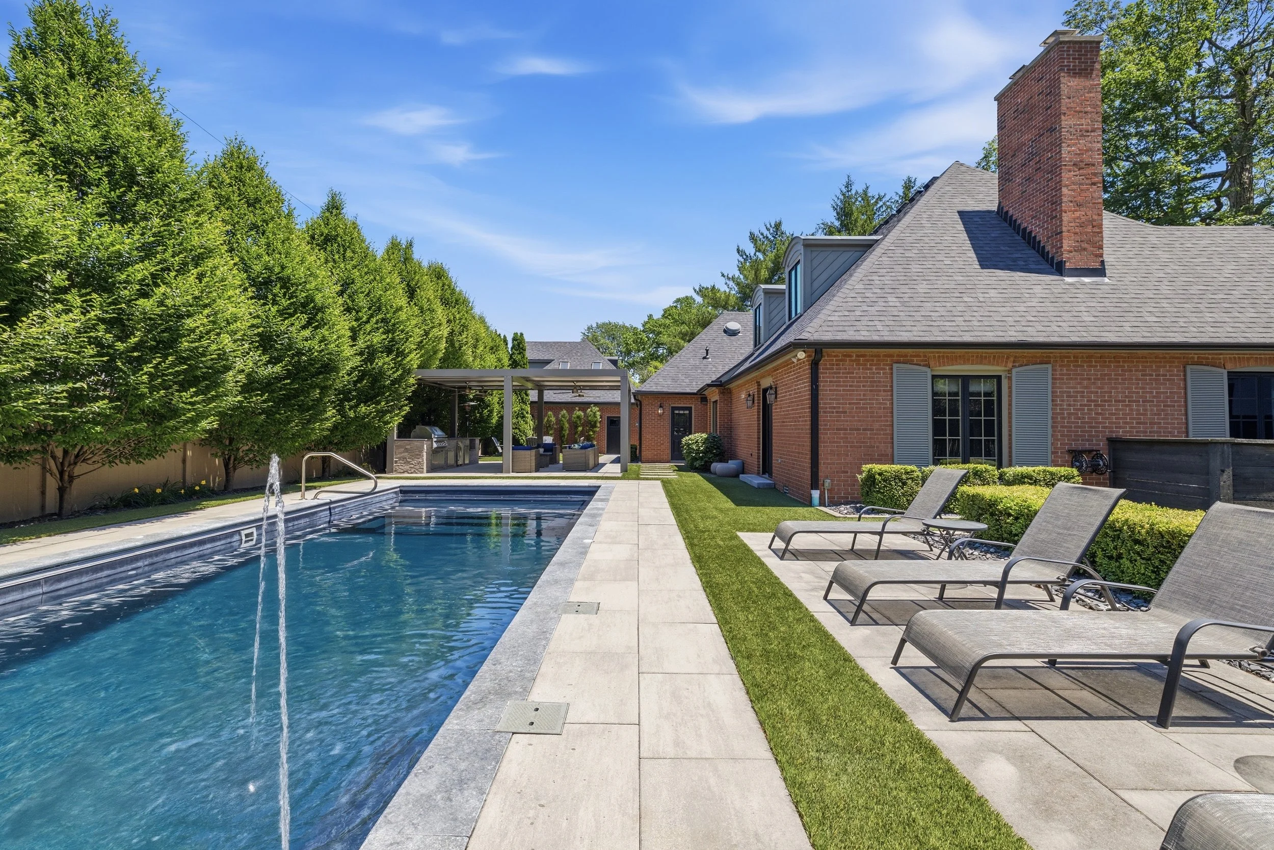 Original daytime photo of the pool and backyard at 110 McClellan Road, Greenfield