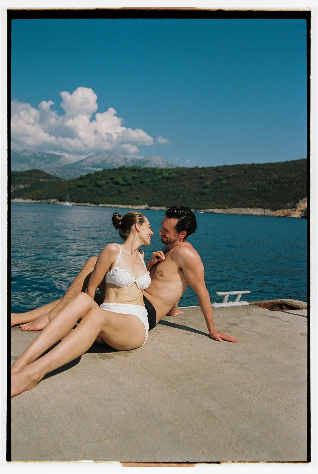 Melise and Remo swimming in the clear blue sea during beach recovery day in Montenegro