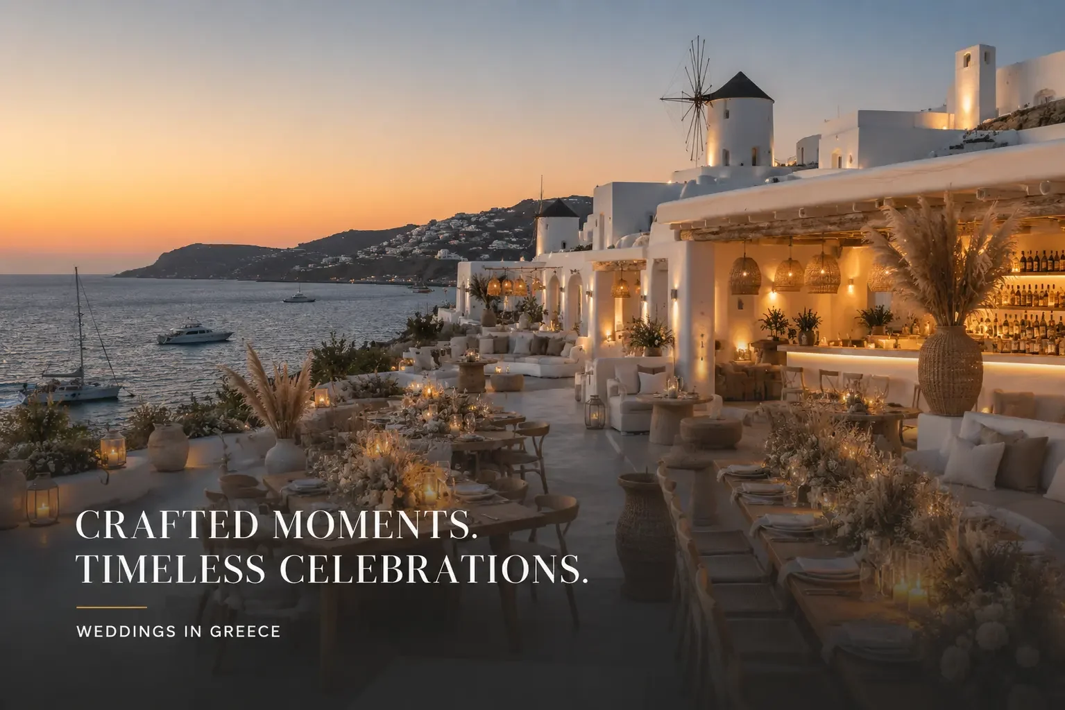 A stylish Mykonos seaside venue at dusk with white Cycladic architecture overlooking the Aegean.